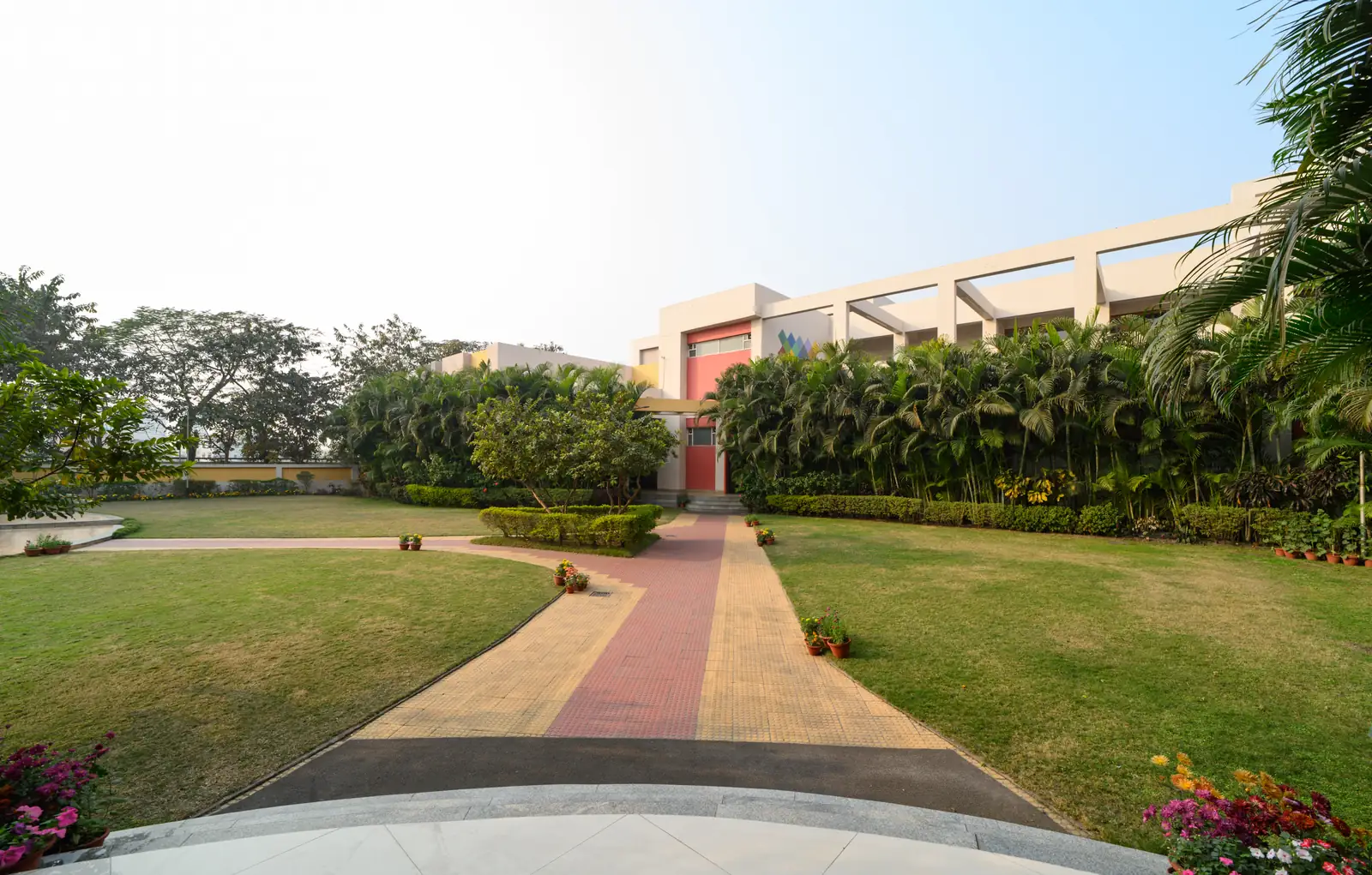 Landscaped lawn and garden pathway at Sinclairs Burdwan