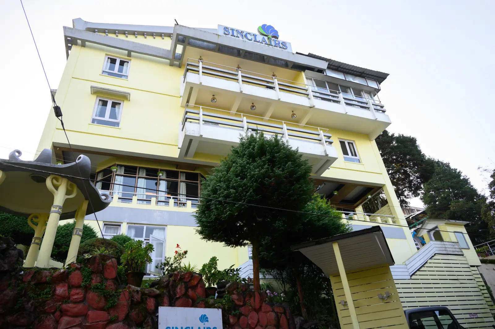 Sinclairs Darjeeling building facade with signage, viewed from the street