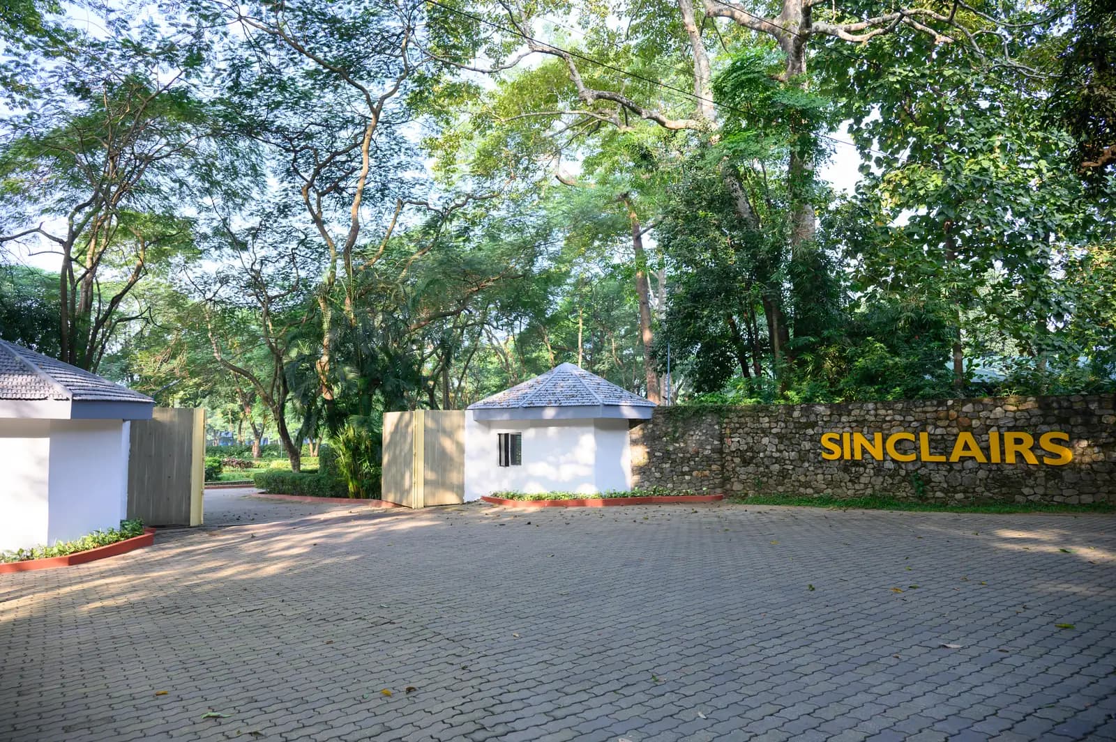 The Sinclairs signage and stone gate marking the entrance to the resort at Chalsa
