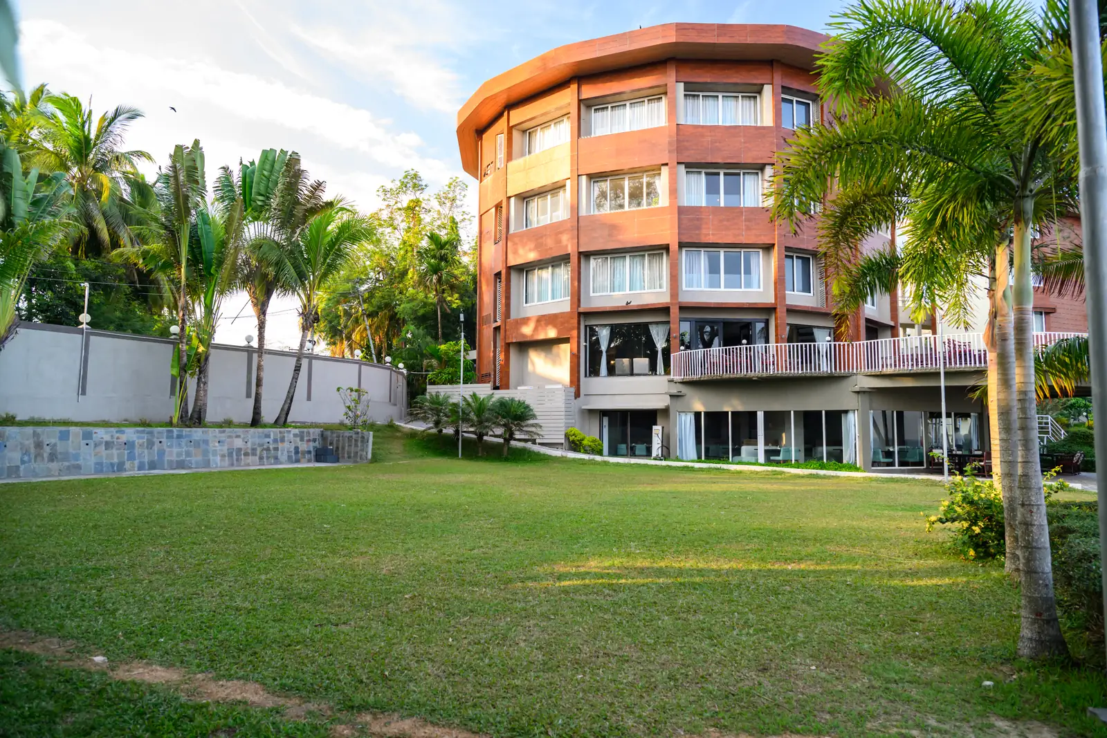 Landscaped garden at Sinclairs Bayview with sea-facing rooms above
