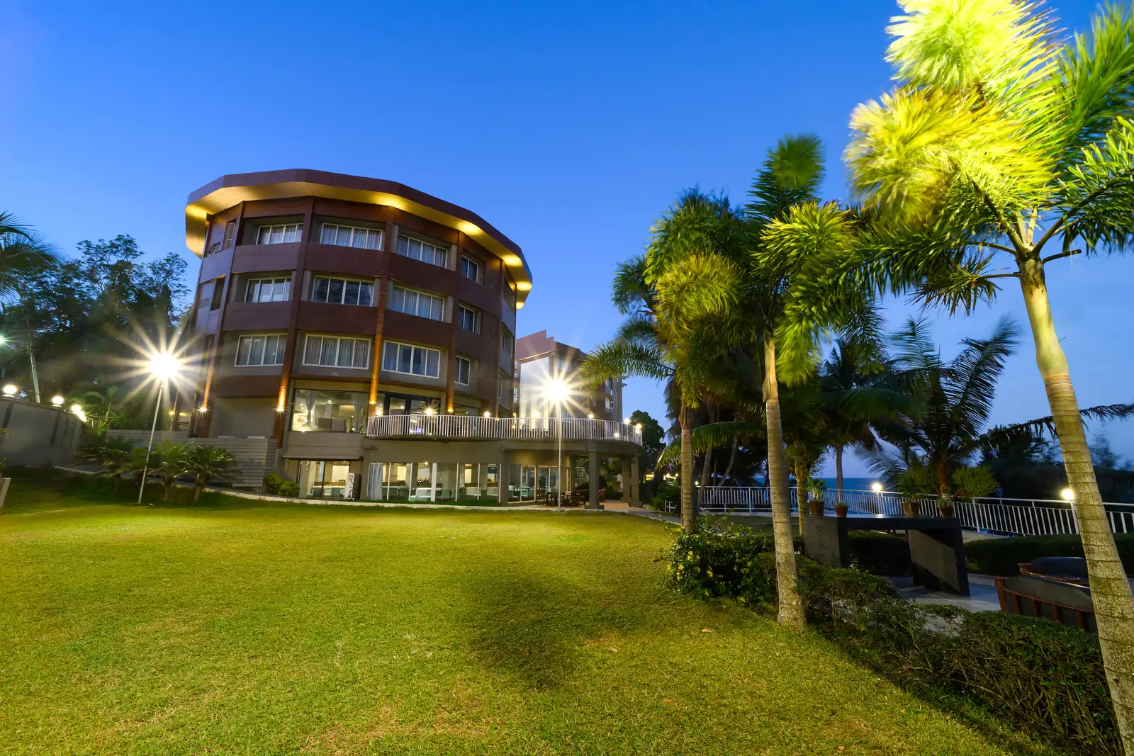 Sinclairs Bayview building facade framed by palm trees