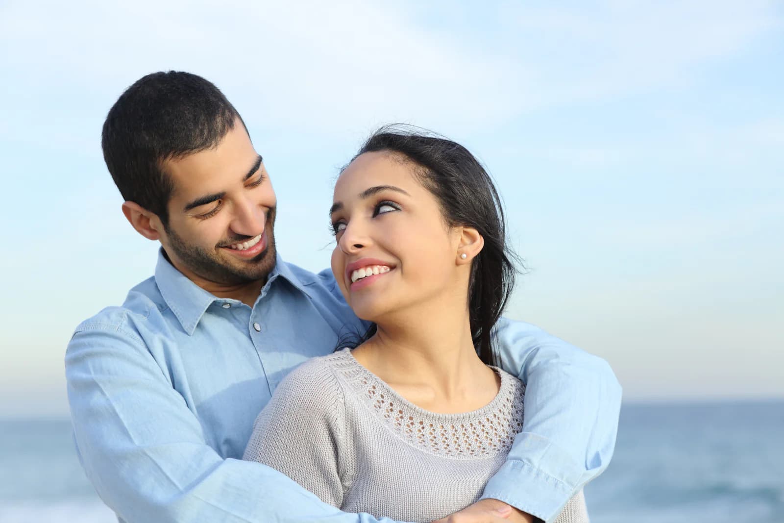 A couple celebrating their wedding by the Bay of Bengal